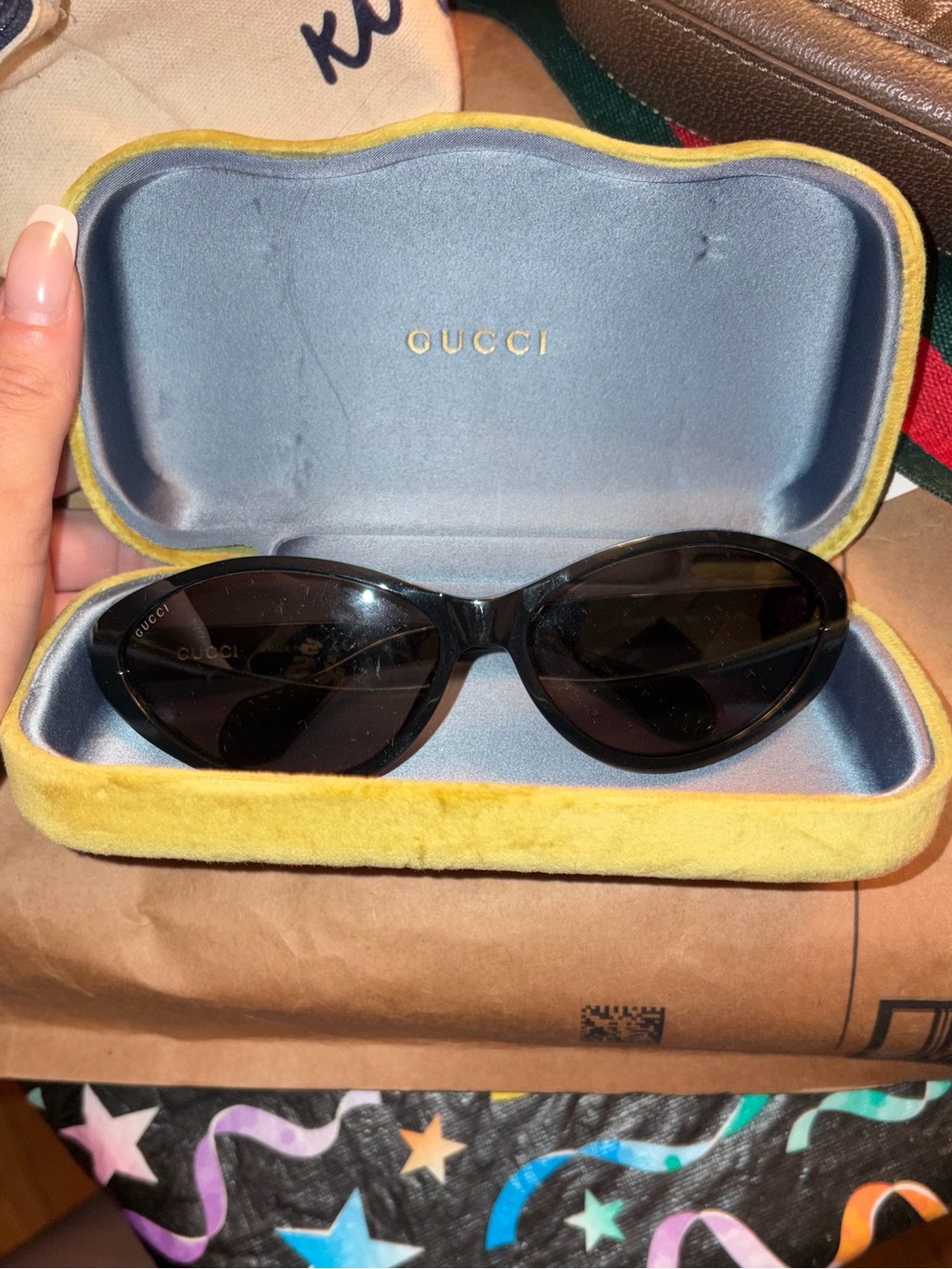 Gucci Women’s Black Cat-Eye Sunglasses with Yellow Velvet Case
